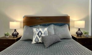 Modern hill country master bedroom gray quilt custom headboard