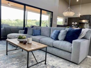 Modern hill country living room grey sofa with chaise