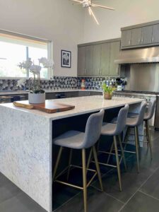 Modern hill country kitchen with grey stools